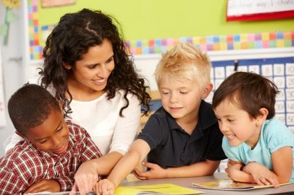 Group Of Elementary Age Schoolchildren In Class With Teacher