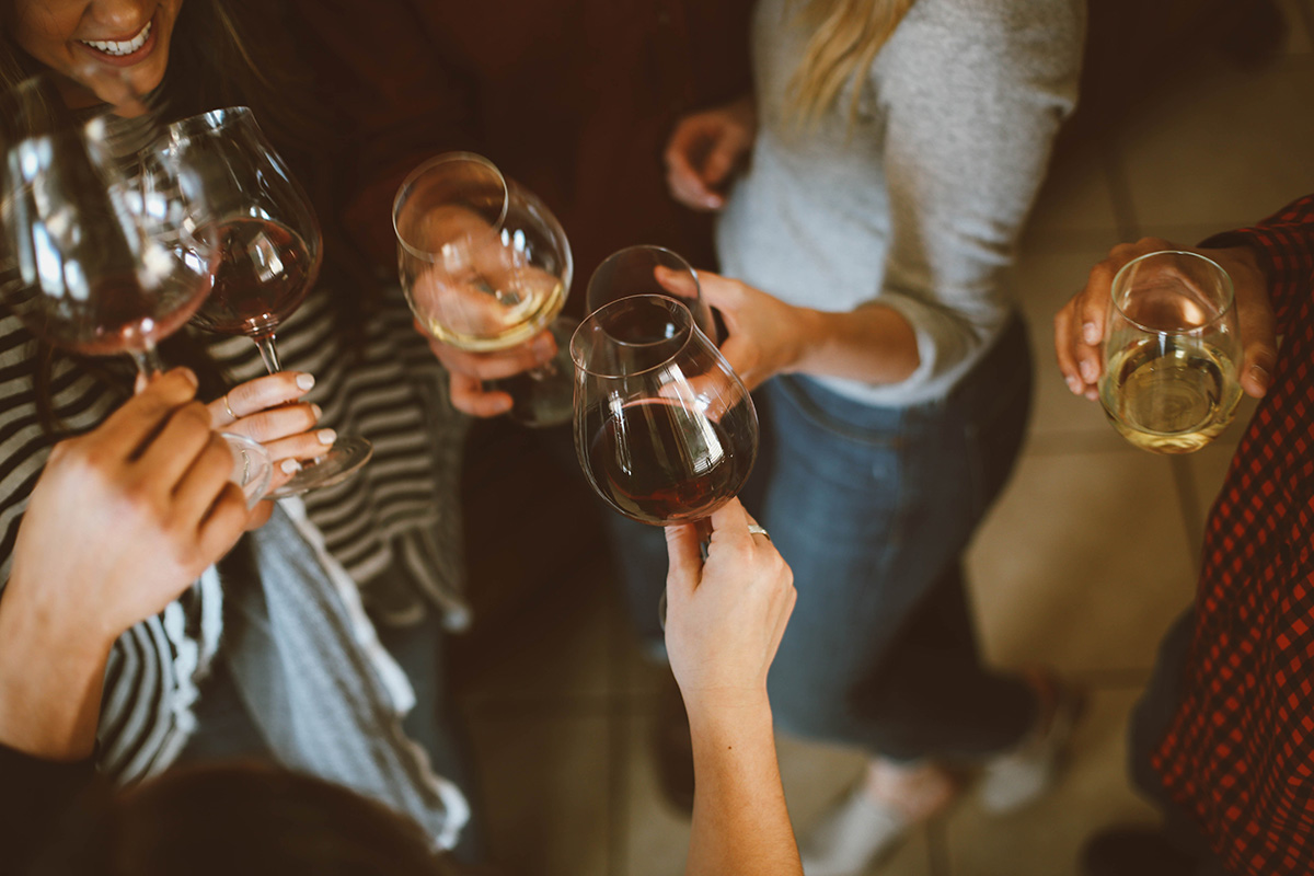 Group of women toasting with wine.