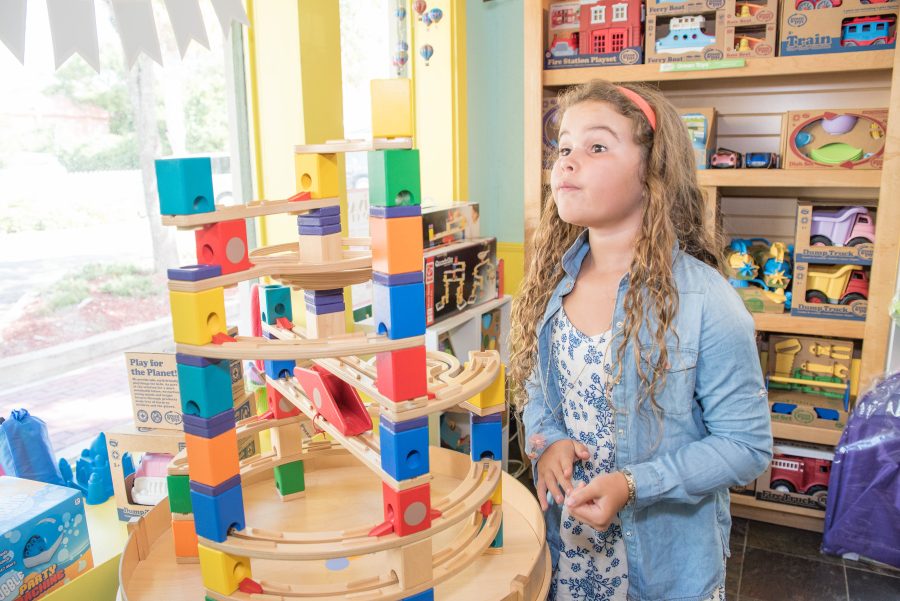 girl playing with marble run