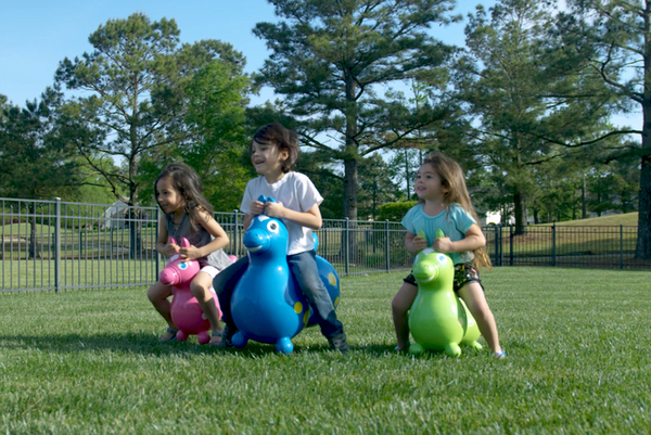 Children riding on Rody Horses