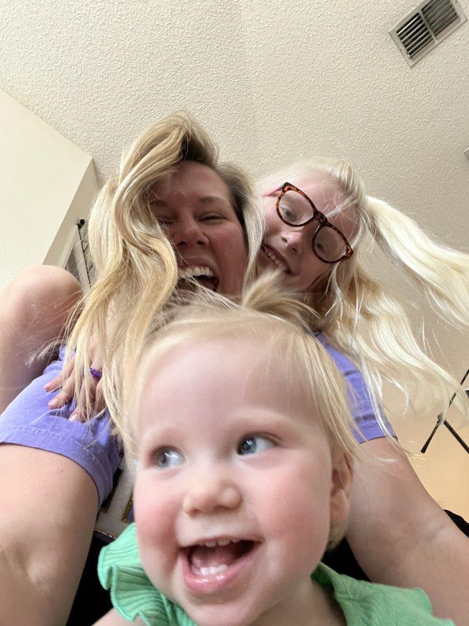 My life is about as blurry and chaotic as this photo of me with my girls. 